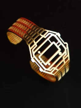 Golden TIMEPEACE bracelet, minimalist design, watch-inspired timepiece jewelry from side against black background 