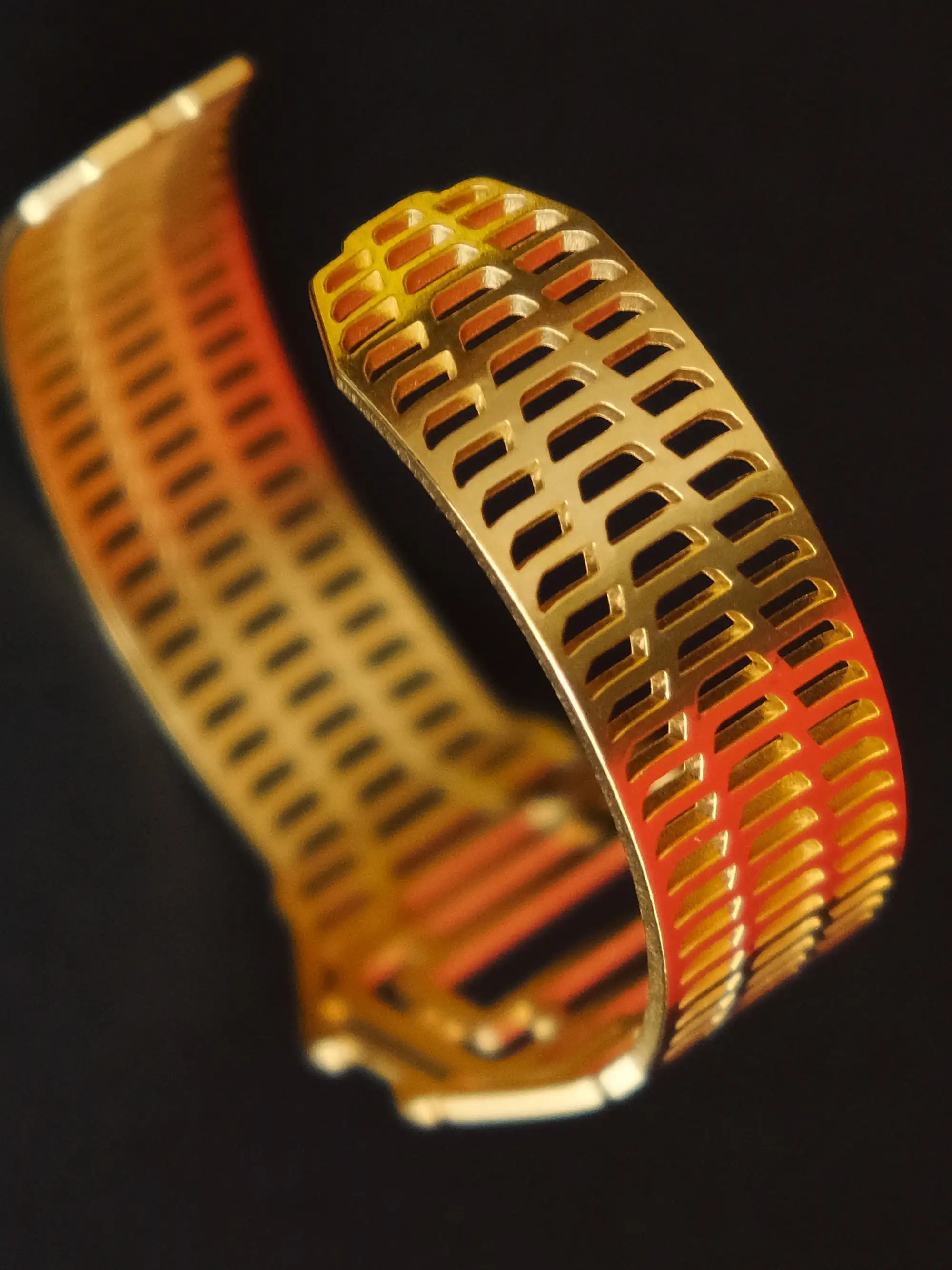 Detail view from Golden TIMEPEACE bracelet, minimalist design, watch-inspired timepiece jewelry from backside against black background