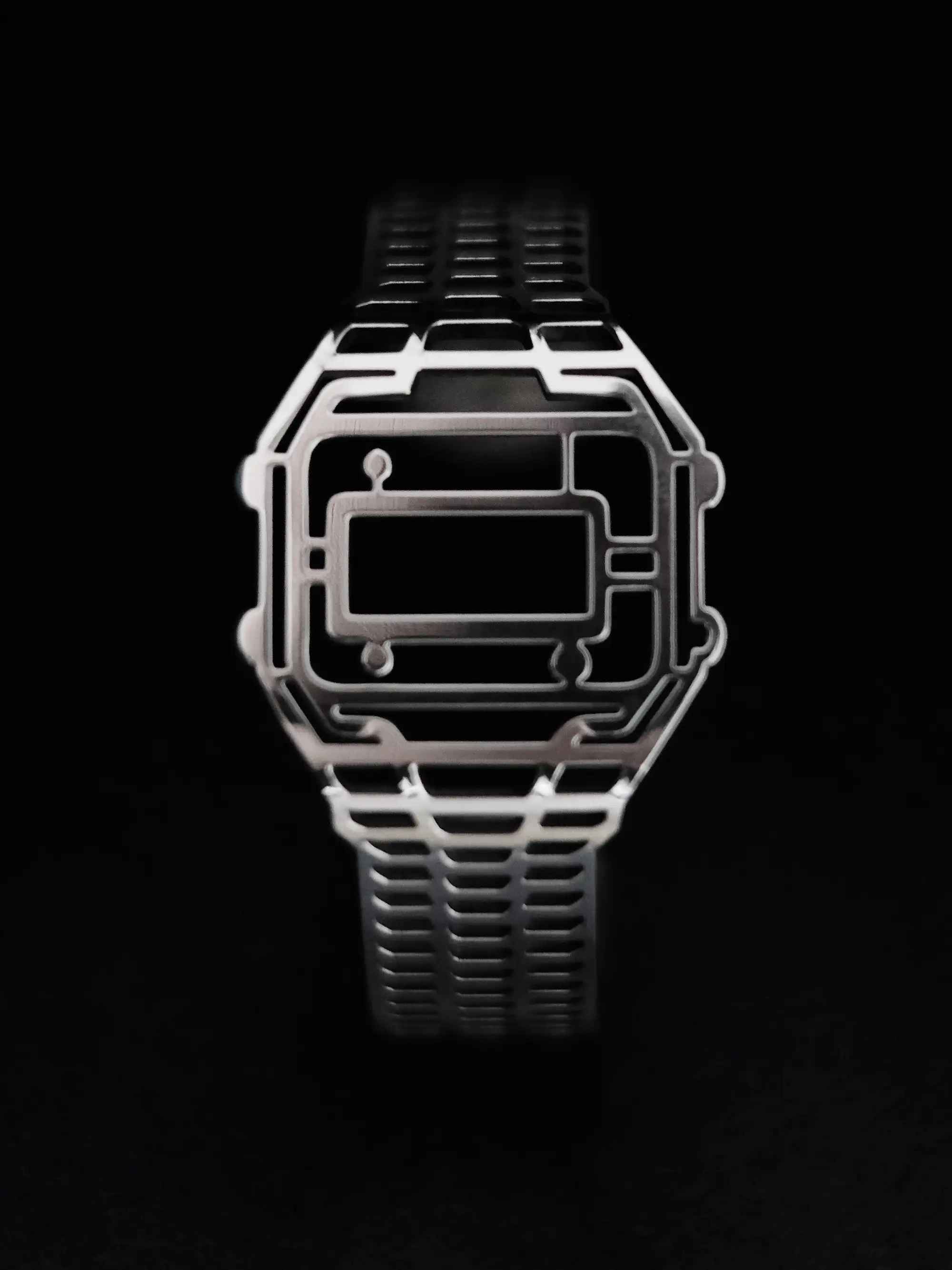 100% recycled sterling silver TIMEPEACE bracelet shown from the front, minimalist timepiece jewelry inspired by vintage digital watches on black background