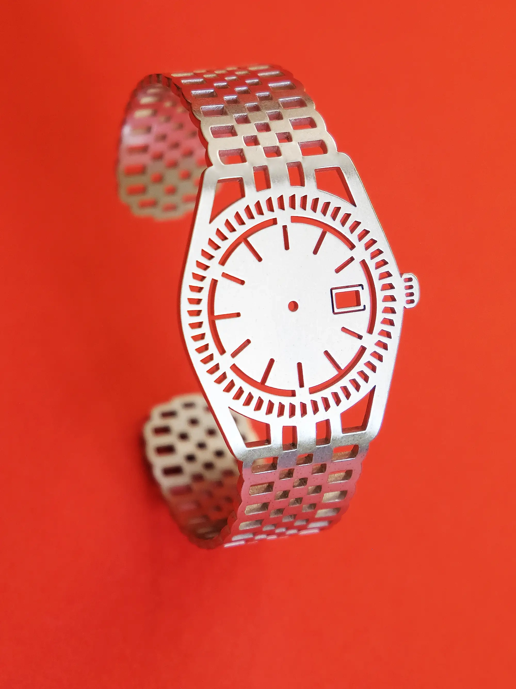Side view of TIMEPEACE minimalist silver bracelet, watch-inspired timepiece jewelry without a time display on a red background