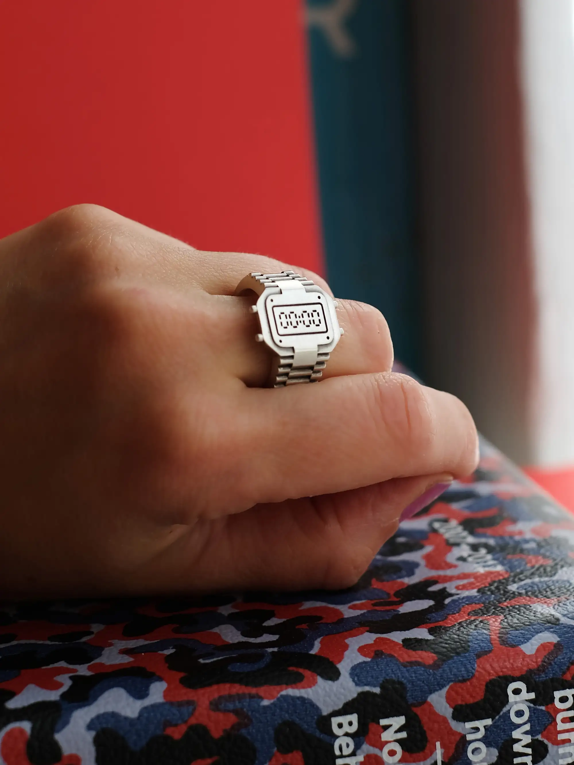 Minimalist TIMEPEACE clockring worn on the finger, recycled sterling silver watch-style ring symbolizing reset and new beginning