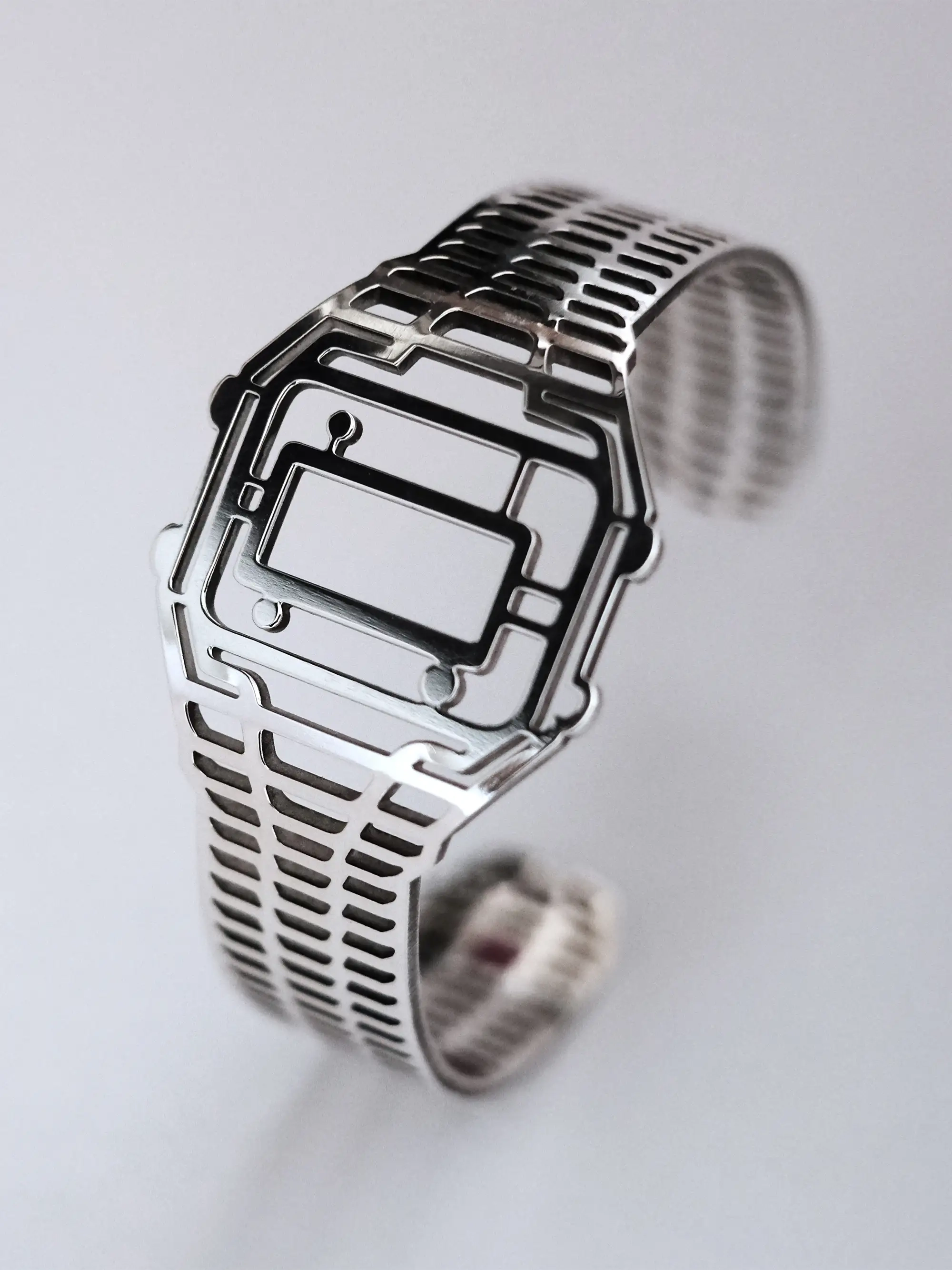 Front view of 100% recycled sterling silver TIMEPEACE bracelet, polished minimalist watch-inspired timepiece jewelry on a light background