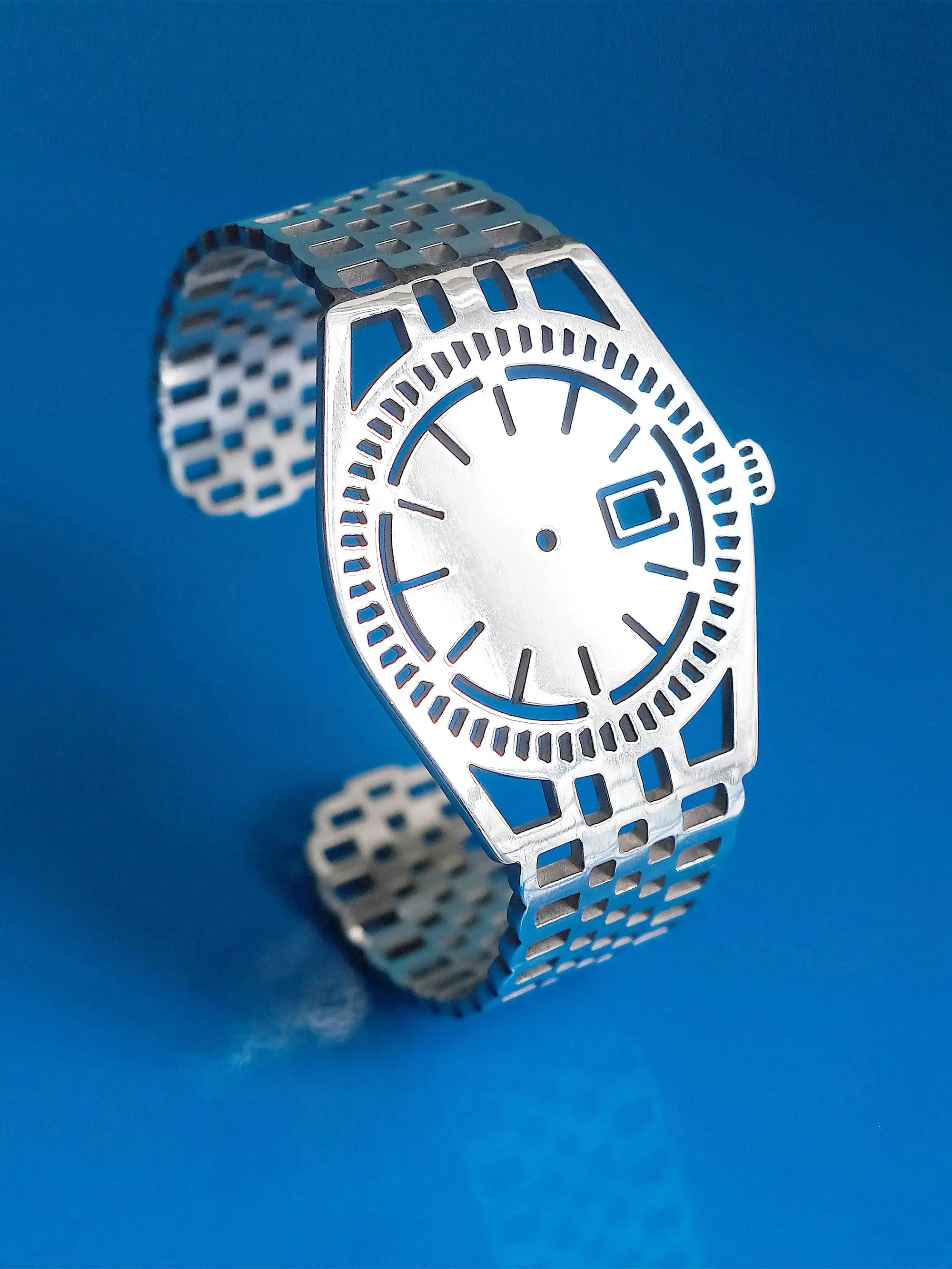 Sterling silver minimalist TIMEPEACE bracelet that looks like a watch, but without showing the time, on blue background